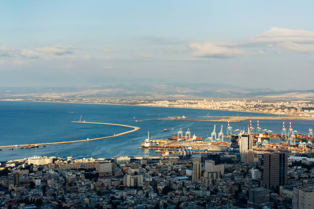 Aerial view industrial cargo port with ships and cranes