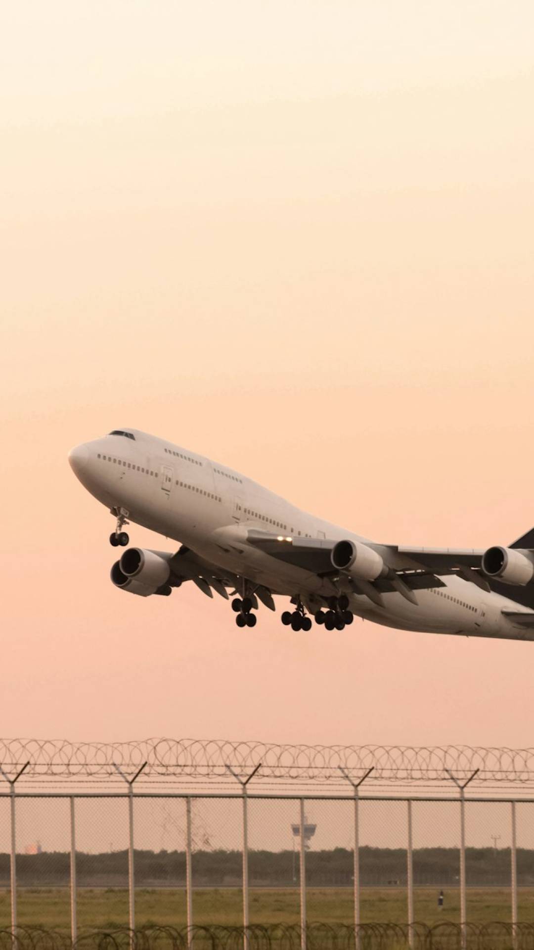 airplane taking off on airport runway at sunset sky background. air logistics and transportation